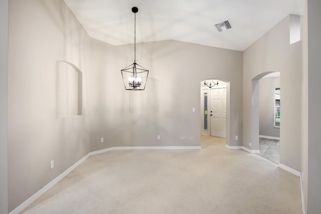 unfurnished room with a chandelier and lofted ceiling