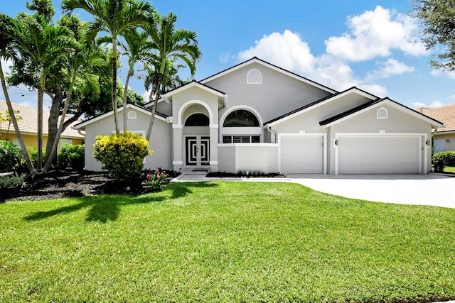 ranch-style house with a front yard and a garage