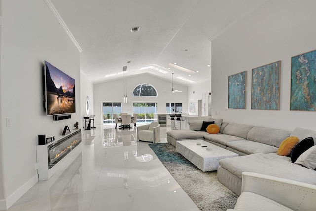 living room featuring lofted ceiling and ornamental molding