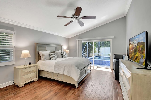 bedroom featuring lofted ceiling, ceiling fan, wood-type flooring, and multiple windows