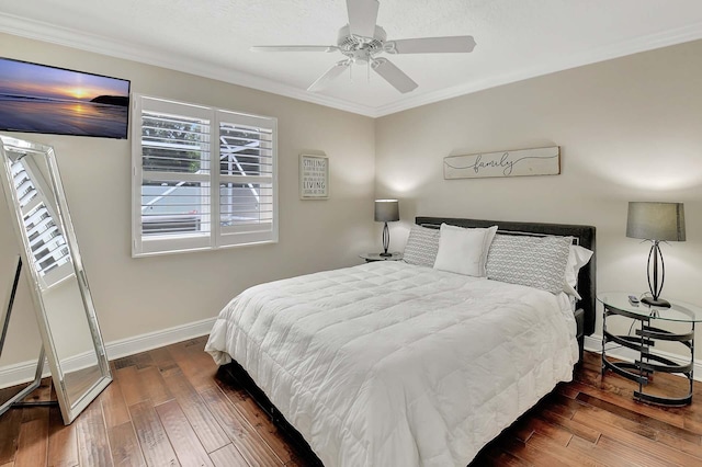 bedroom with crown molding, ceiling fan, and dark hardwood / wood-style flooring