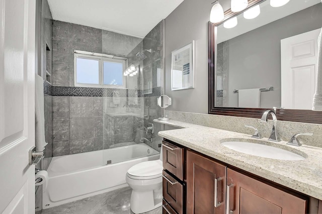 full bathroom with vanity, toilet, and tiled shower / bath combo