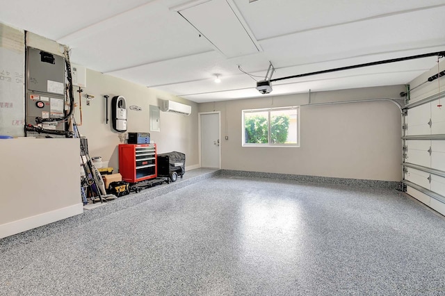 garage with a garage door opener and a wall unit AC