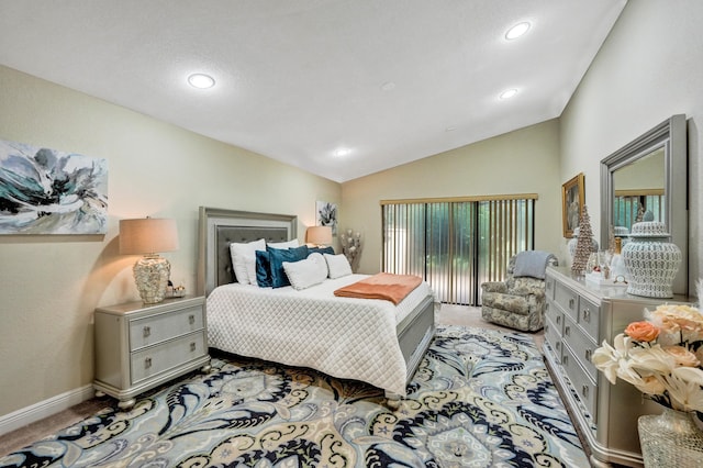 carpeted bedroom with access to exterior and vaulted ceiling