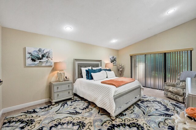 carpeted bedroom featuring vaulted ceiling