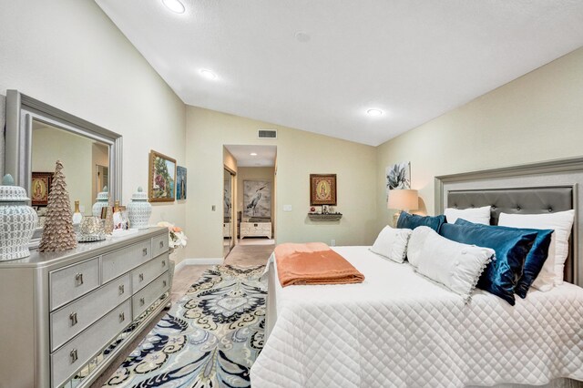 bedroom with vaulted ceiling