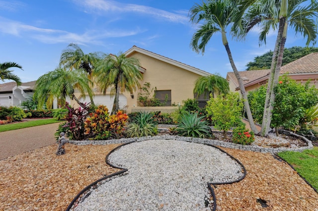 view of front of property featuring stucco siding and a garage