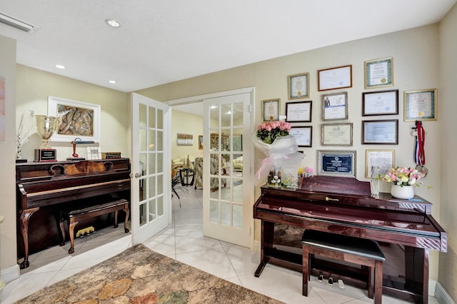 misc room with french doors and light tile patterned flooring