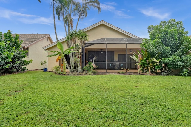 11111 Highland Cir, Boca Raton, FL 33428 - back of property featuring a ceiling fan, stucco siding, and a yard