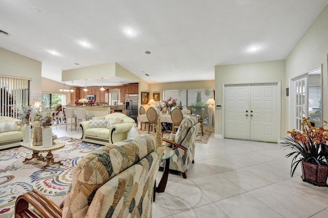 11111 Highland Cir, Boca Raton, FL 33428 - living area featuring light tile patterned floors, vaulted ceiling, and recessed lighting