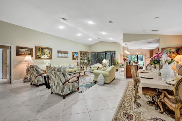 living room featuring lofted ceiling and light tile patterned floors