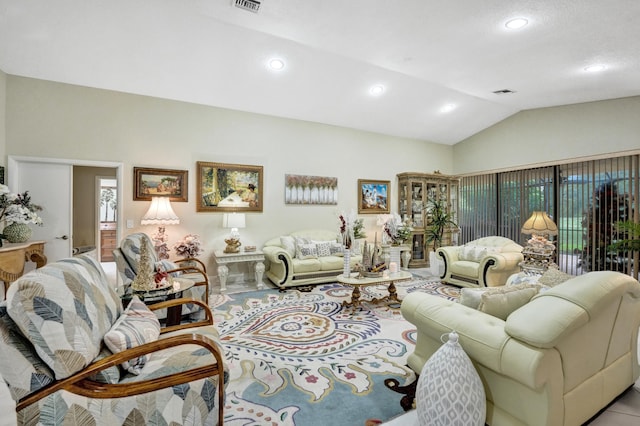 living room featuring lofted ceiling