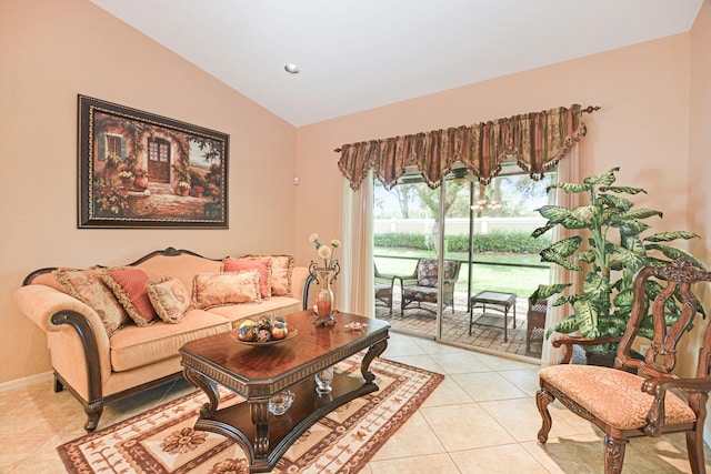 living room with light tile patterned floors and vaulted ceiling