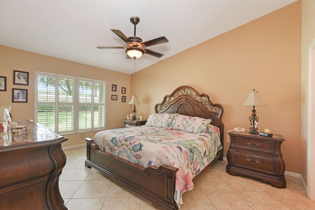 tiled bedroom with ceiling fan