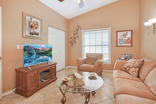 tiled living room featuring vaulted ceiling and ceiling fan