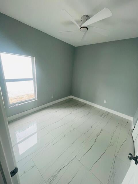 unfurnished room featuring ceiling fan