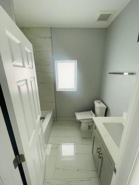 bathroom with vanity and toilet