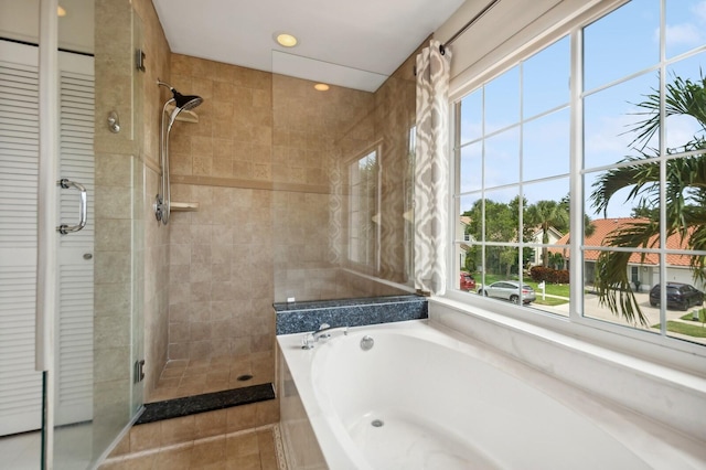 bathroom with tile patterned floors and plus walk in shower