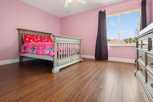 bedroom with wood-type flooring and ceiling fan