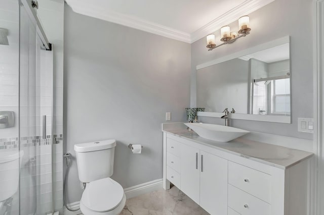 bathroom with crown molding, vanity, toilet, and a shower with shower door