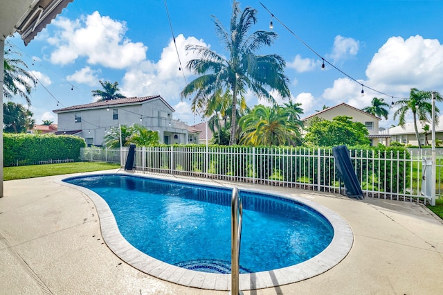 view of swimming pool with a patio area, a fenced backyard, and a fenced in pool