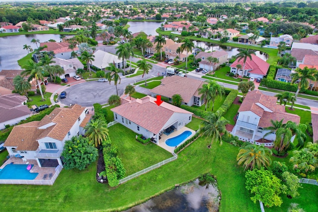 bird's eye view with a residential view and a water view