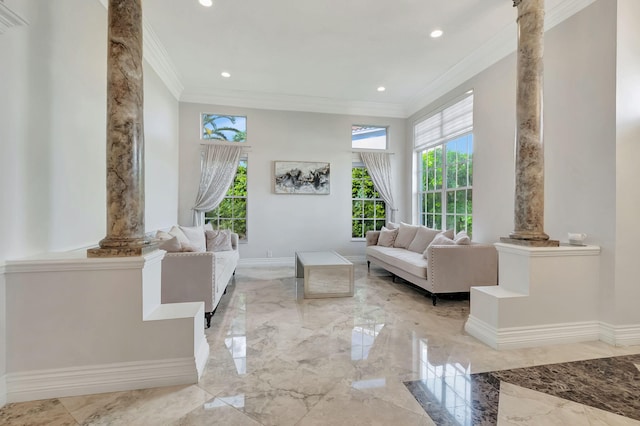 interior space featuring crown molding and ornate columns