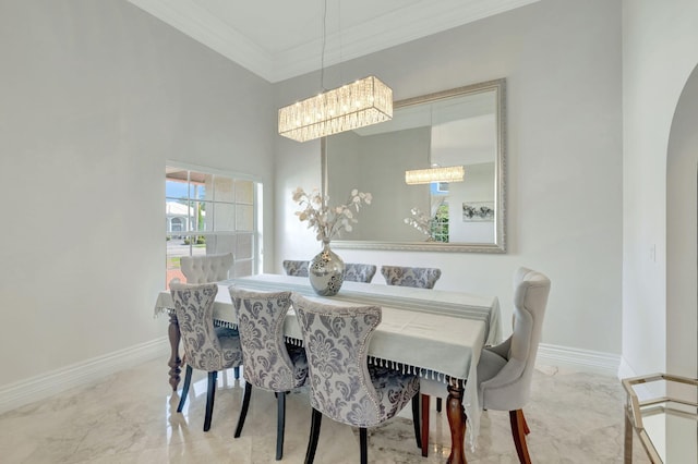 dining space with crown molding and an inviting chandelier