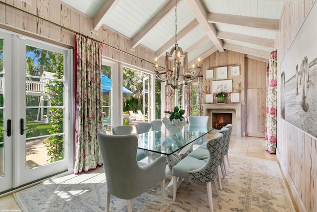 unfurnished sunroom featuring a chandelier, lofted ceiling with beams, and wooden ceiling