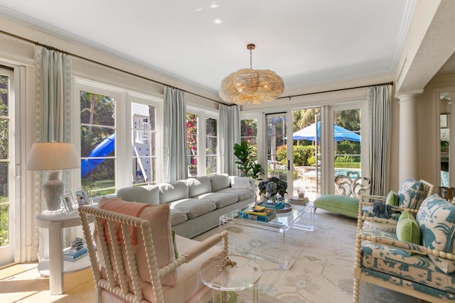 living room with ornamental molding and plenty of natural light