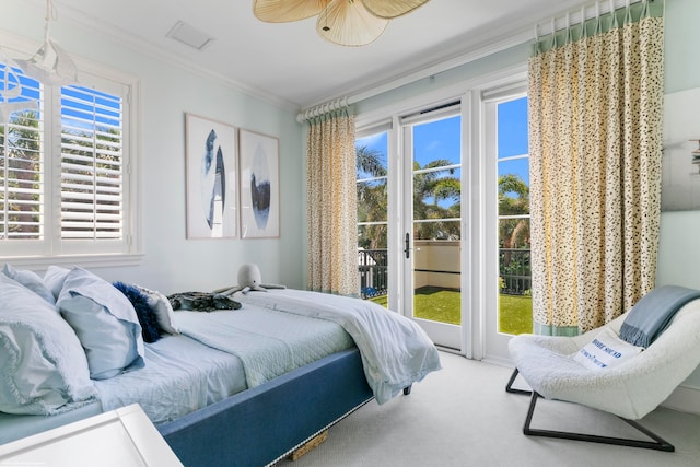 carpeted bedroom with crown molding, multiple windows, access to outside, and ceiling fan