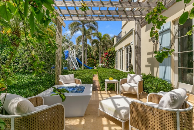 view of patio / terrace with an outdoor living space and a pergola