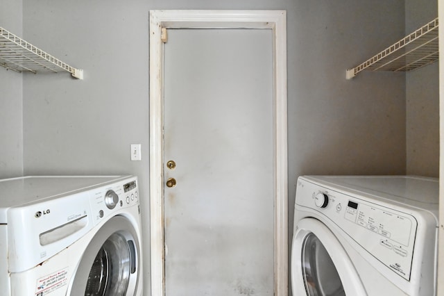 clothes washing area featuring independent washer and dryer