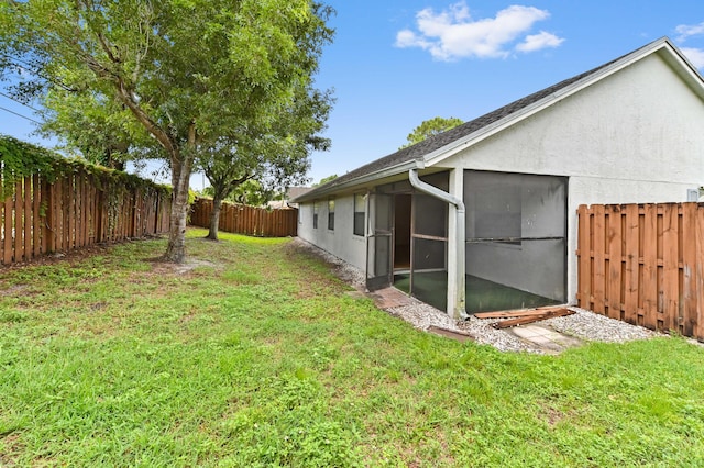 view of yard featuring a sunroom