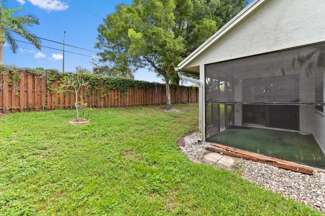 view of yard featuring a sunroom