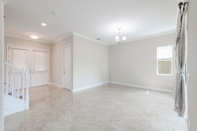 unfurnished room featuring a chandelier and crown molding