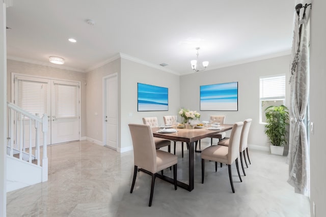 dining space featuring a notable chandelier and ornamental molding