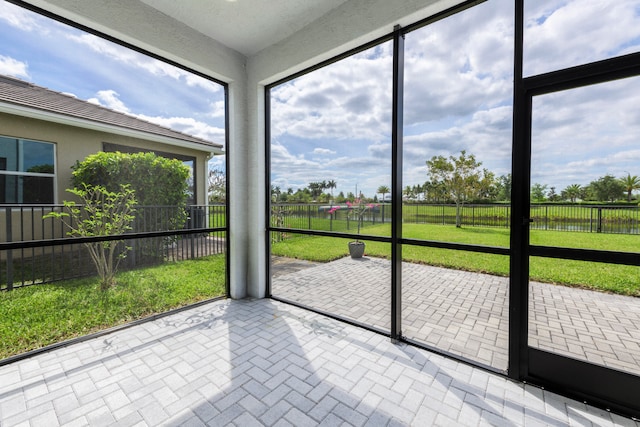 unfurnished sunroom featuring a healthy amount of sunlight