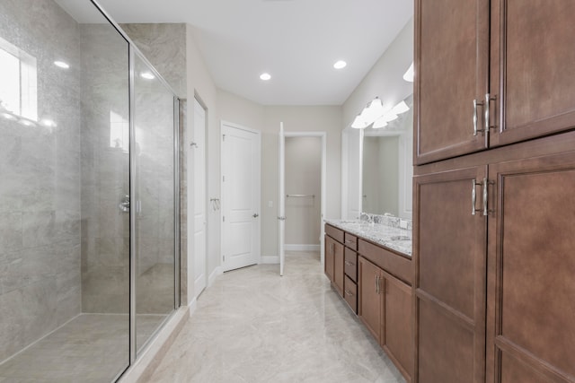 bathroom featuring vanity and an enclosed shower