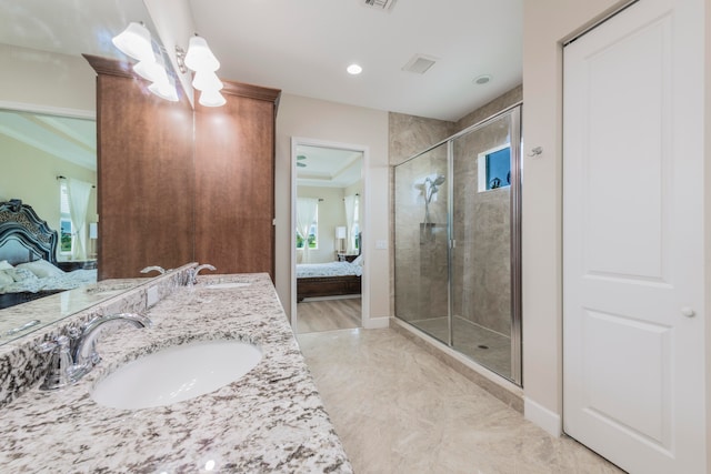 bathroom with vanity, crown molding, and a shower with shower door