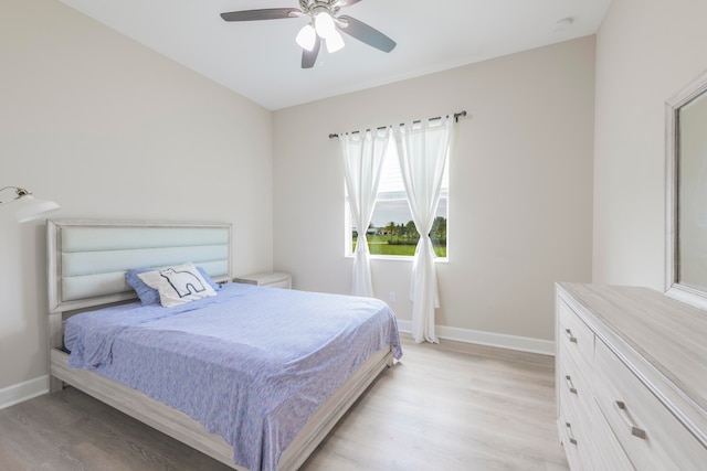 bedroom with light hardwood / wood-style flooring and ceiling fan