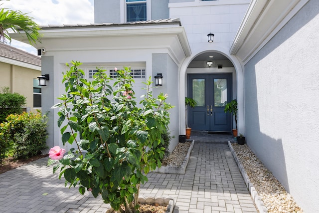 property entrance featuring french doors