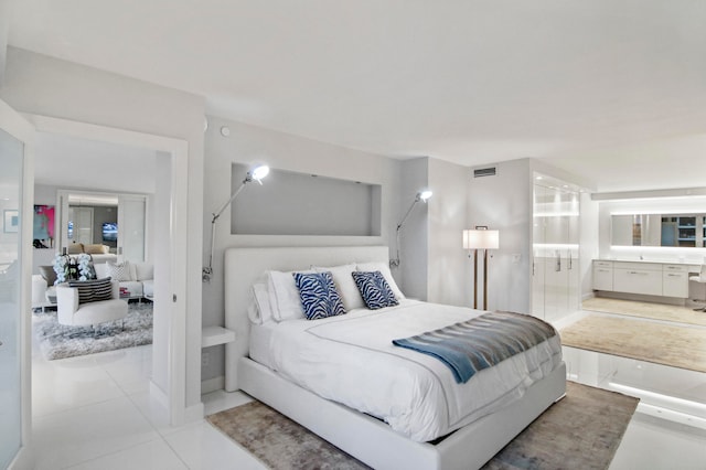 bedroom with light tile patterned floors