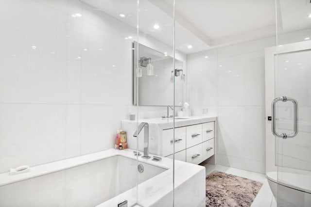 bathroom with vanity, plus walk in shower, and tile patterned flooring