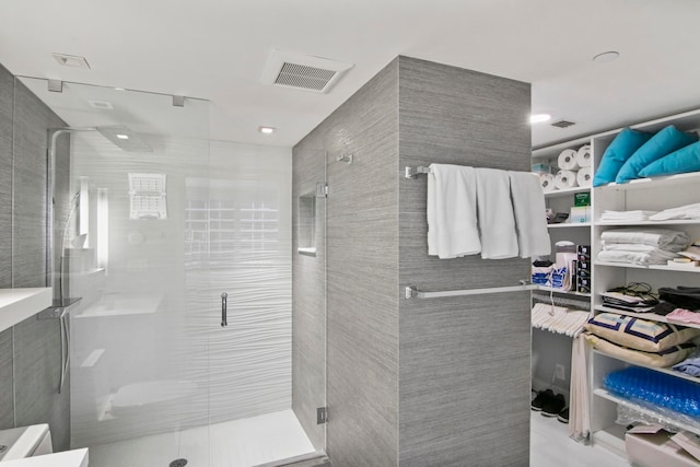 bathroom featuring an enclosed shower