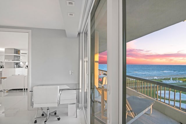 interior space featuring a view of the beach and a water view