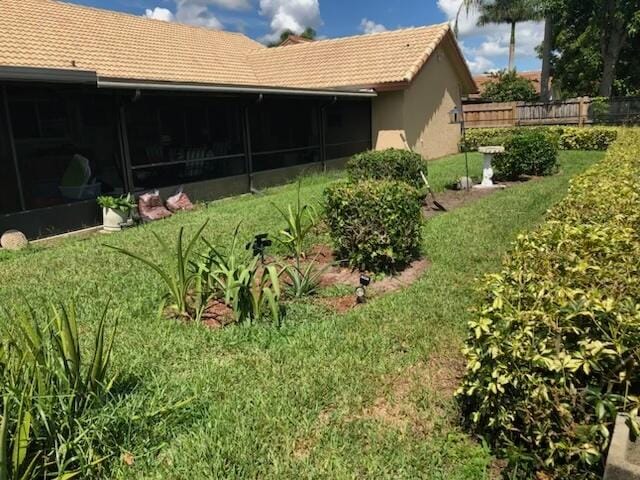 view of yard with a sunroom