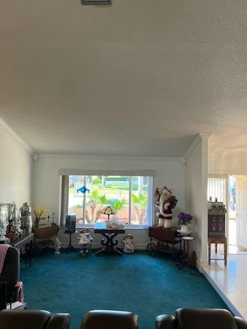 unfurnished living room with carpet floors, a textured ceiling, and ornamental molding