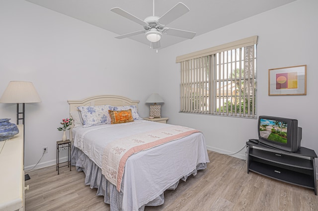 bedroom featuring light wood-type flooring and ceiling fan