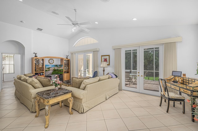 living room featuring high vaulted ceiling, ceiling fan, light tile patterned floors, and french doors